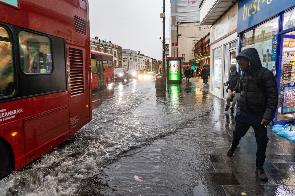 Commuters brave the wind and heavy rain in Putney, south west London