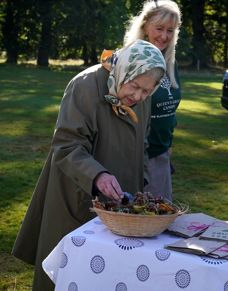 The Queen examined the children's tree cones