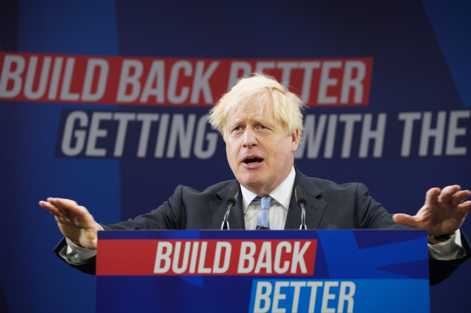 Boris Johnson addresses the Tory party faithful in Manchester