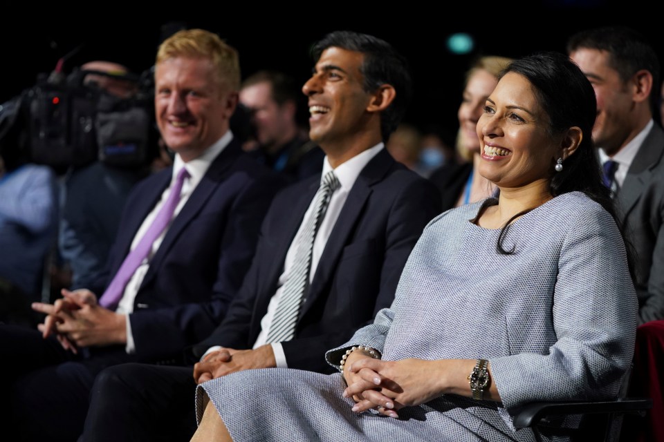 Oliver Dowden, Rishi Sunak and Priti Patel watch the speech