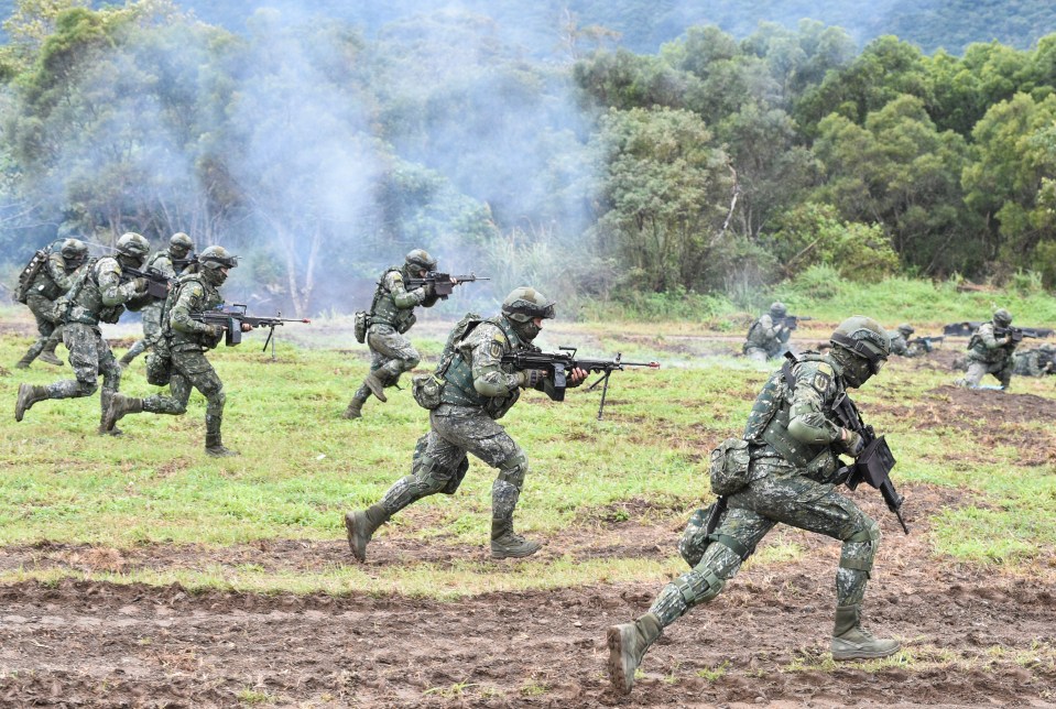 Taiwanese troops, pictured carrying out anti-invasion drills, have been secretly trained by US forces