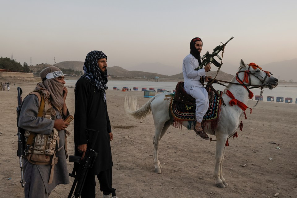 And one Taliban fighter even rode a horse by the beach while clutching his assault weapon