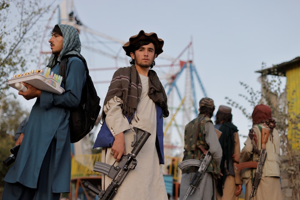 Taliban fighters explore the Kabul amusement park