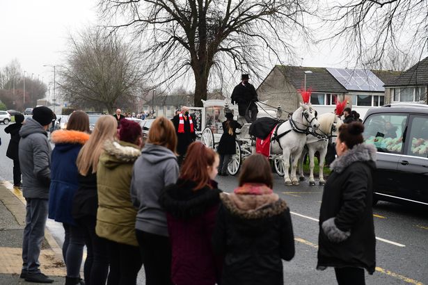 Hundreds of mourners lined the street for the schoolboys funeral in January