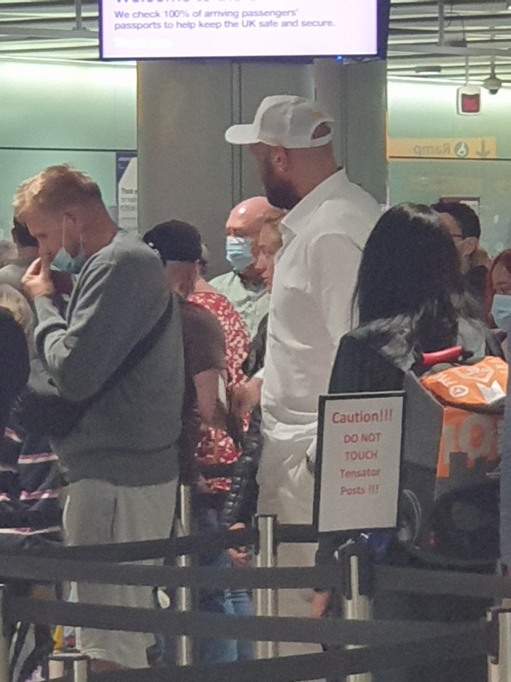 Tyson Fury Fury touched down around 11am, and was pictured by SunSport queuing up at passport control