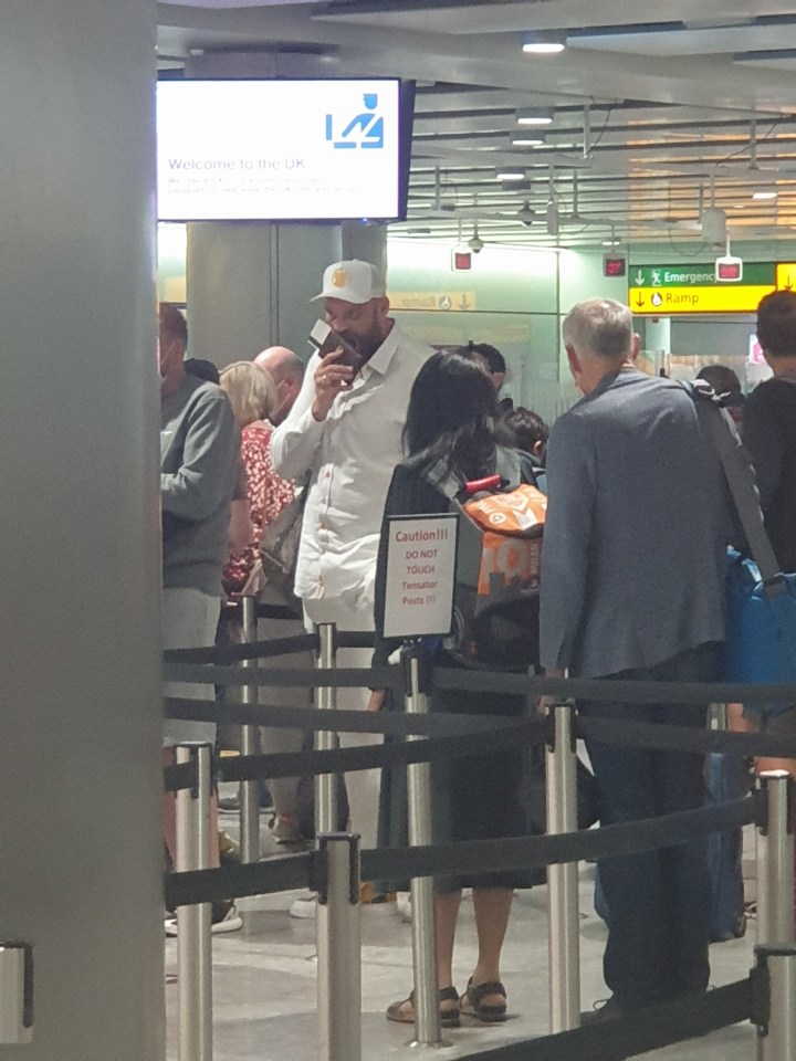 A yawning Tyson Fury landed at Heathrow T3 from a flight back from America