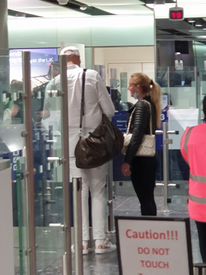 Tyson Fury was decked out in all white as he returned home with his wife Paris