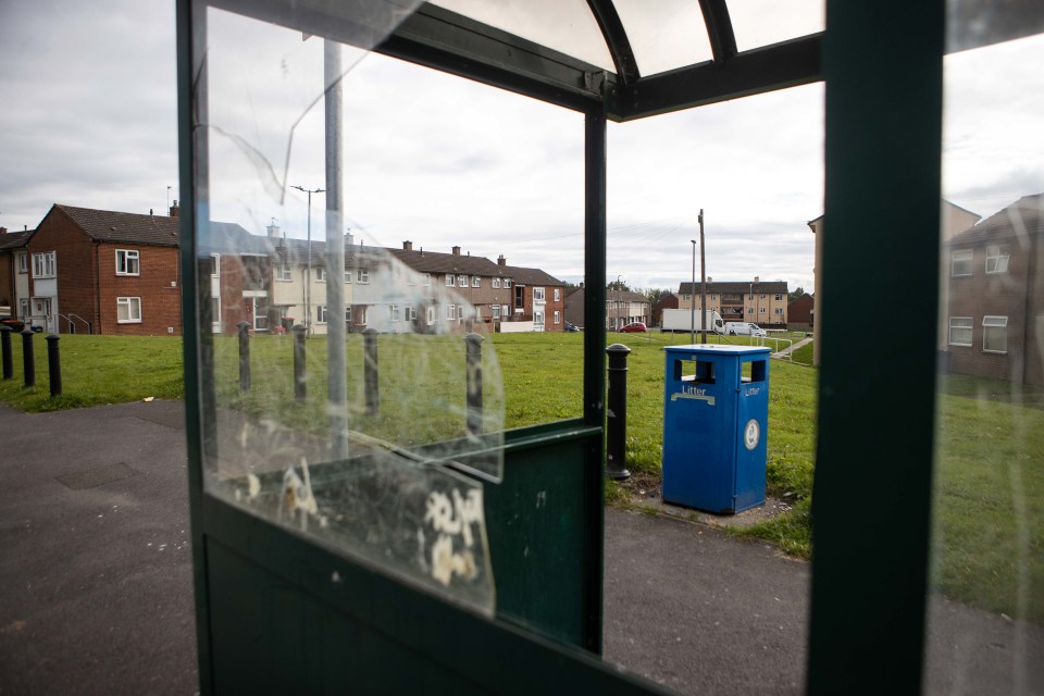 Glass at a bus stop is smashed