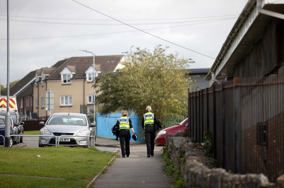 Police are seen patrolling the estate