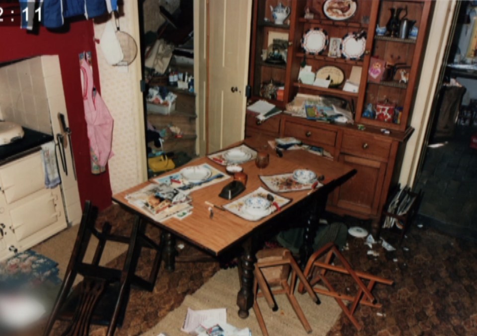 The upturned chairs in the kitchen suggested a struggle