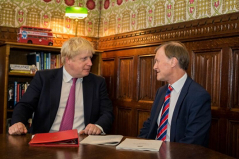 Sir David is seen discussing Brexit with the PM in 2016