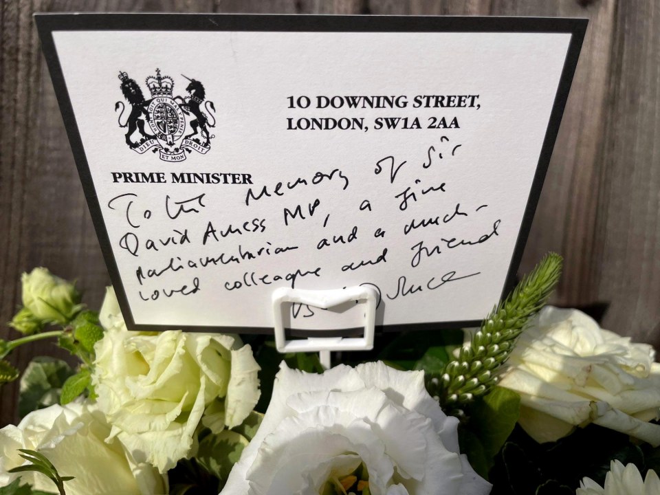 A tribute on a card from No 10 was laid next to flowers