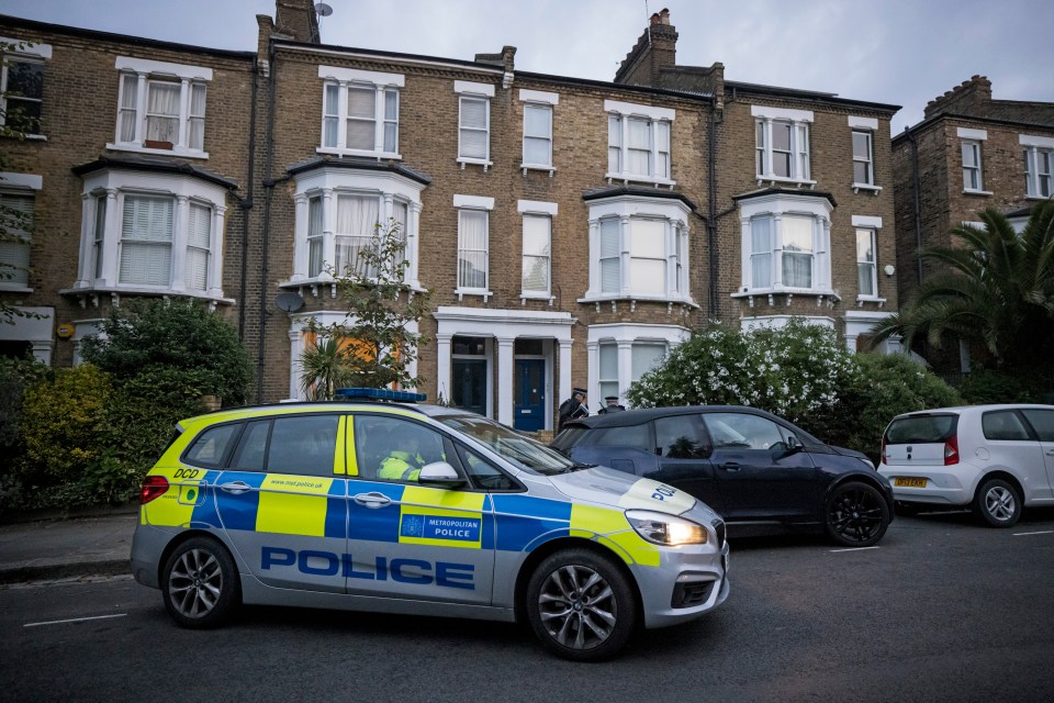 Officers pictured guarding the property where suspect Ali Harbi Ali lives