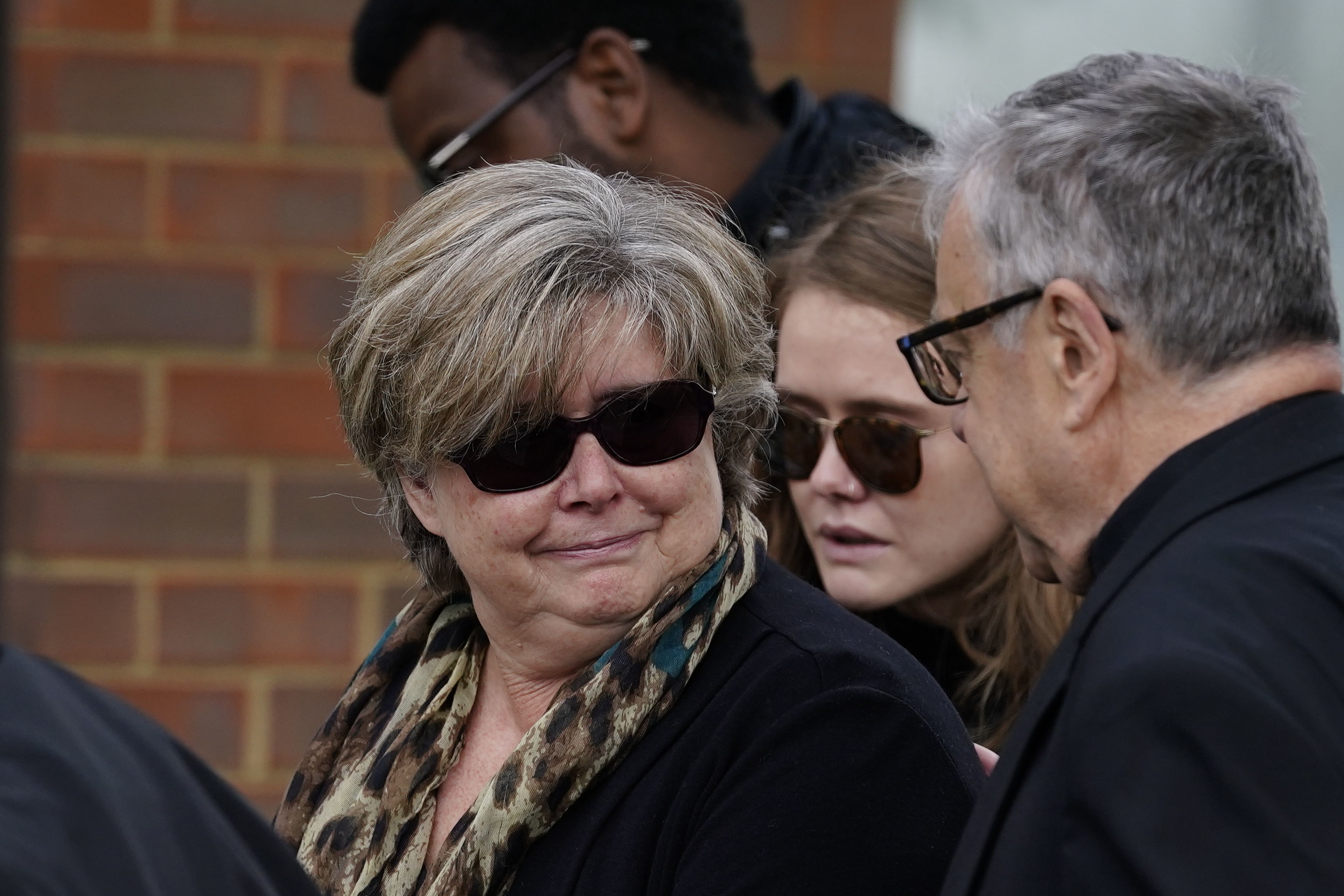 Sir David's wife Julia visits a memorial for her murdered husband today Credit: PA