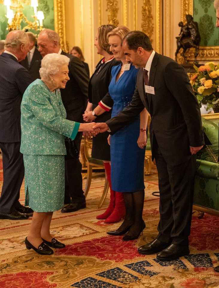 The Queen appeared in fine spirits as she met with international business and investment leaders at Windsor Castle last night