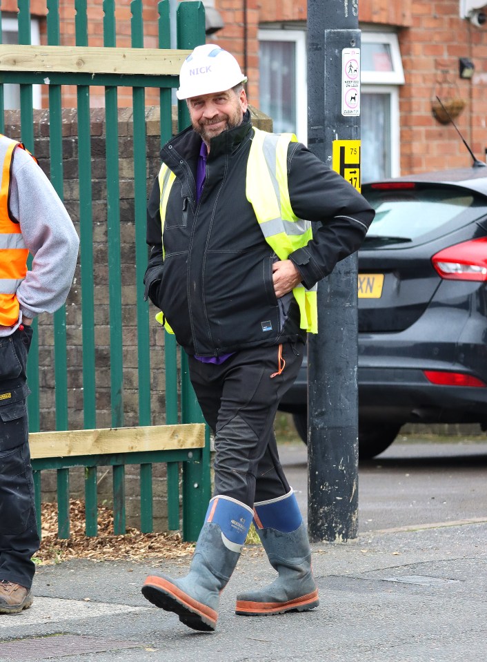 He donned a personalised hard hat and hi-vis vest