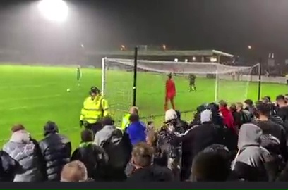 This unsuspecting steward was keeping a keen eye on the crowd during Yeovil's FA Cup game at Weymouth