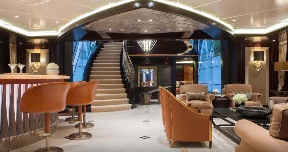 It's fitted out with a grand spiral staircase, floor-to-ceiling TV screens, and surfaces of marble and gold