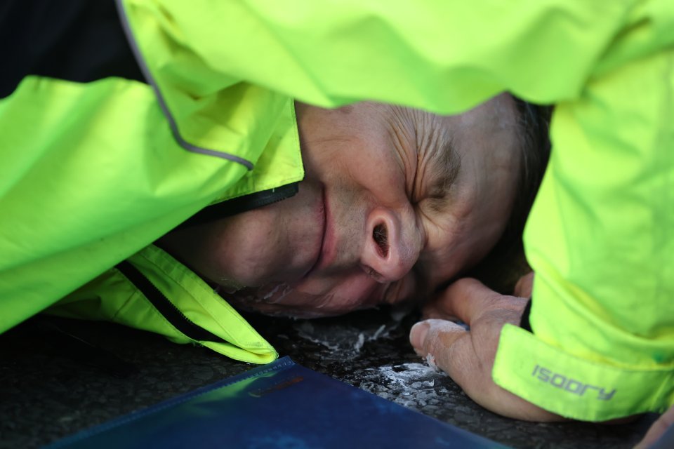 A demonstrator - who gave his name as Matthew - glued his face directly onto the road