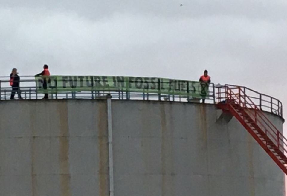 Attention-hungry demonstrators scaled ExxonMobil's huge tank