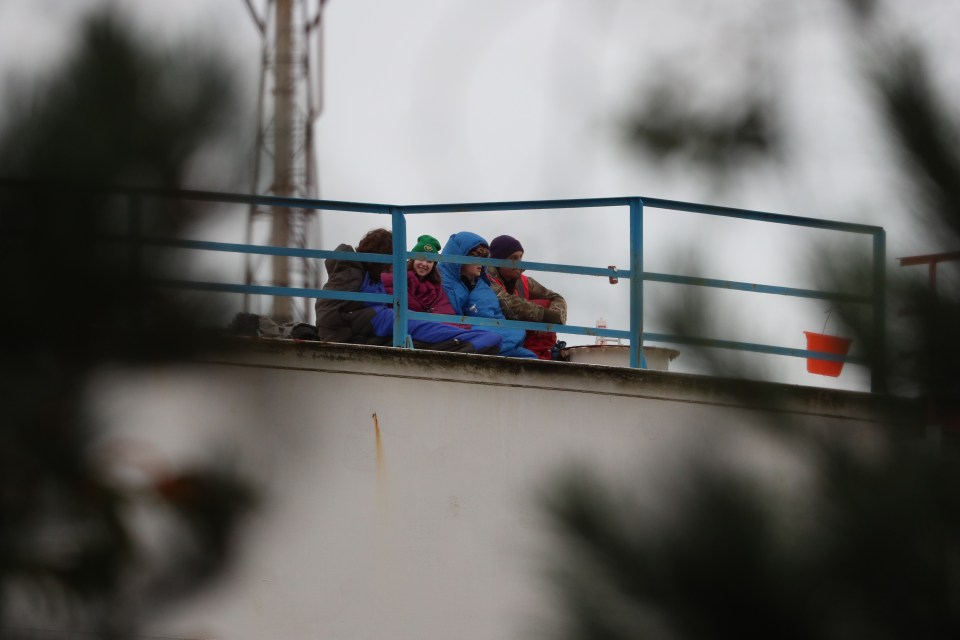 Protesters were seen on top of the tower