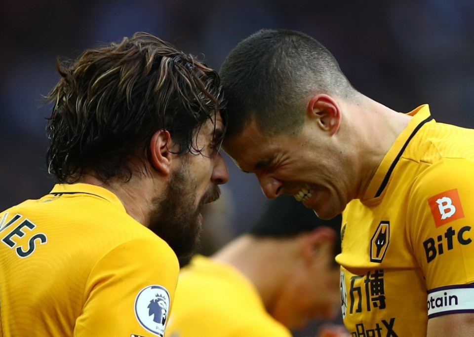 Ruben Neves (left) and Conor Coady celebrate after winning the game for Wolves