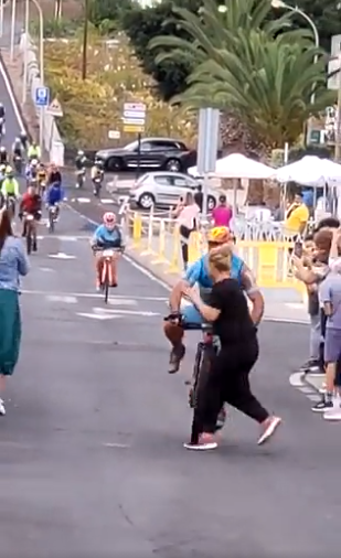 The spectator walked out without realising the cyclist was passing