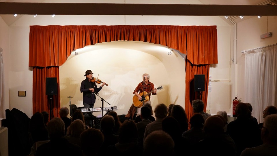 Chris, 73, was on stage as part of a folk and blues duo at Compton ­Parish Rooms in West Sussex