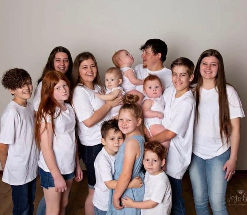 There are 14 people in the Church family, with 12 children including a set of toddler triplets