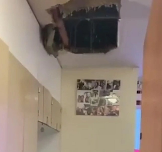 Water poured in from the ceiling of a British Army barracks after par of the ceiling collapsed