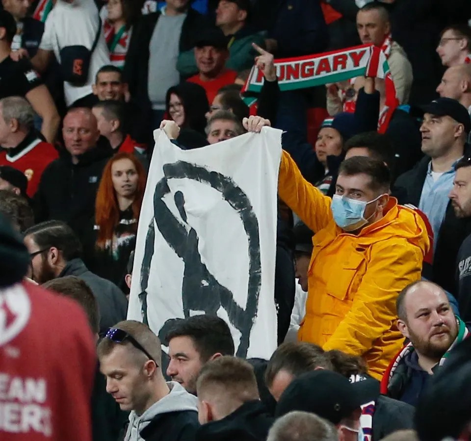 One fan held up a banner against players taking the knee