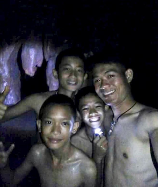 A picture of the trapped boys taken by rescue divers inside Tham Luang cave