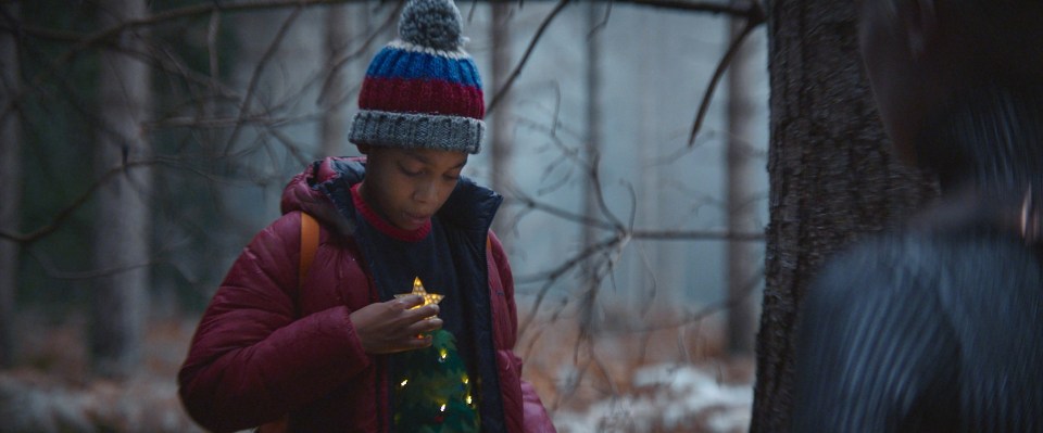 Nathan meets her in the forest and they bond over his light-up Xmas jumper