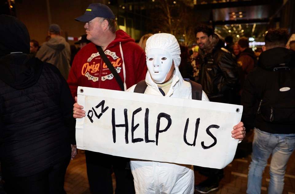 A protester rallying against the reintroduction of Covid restrictions