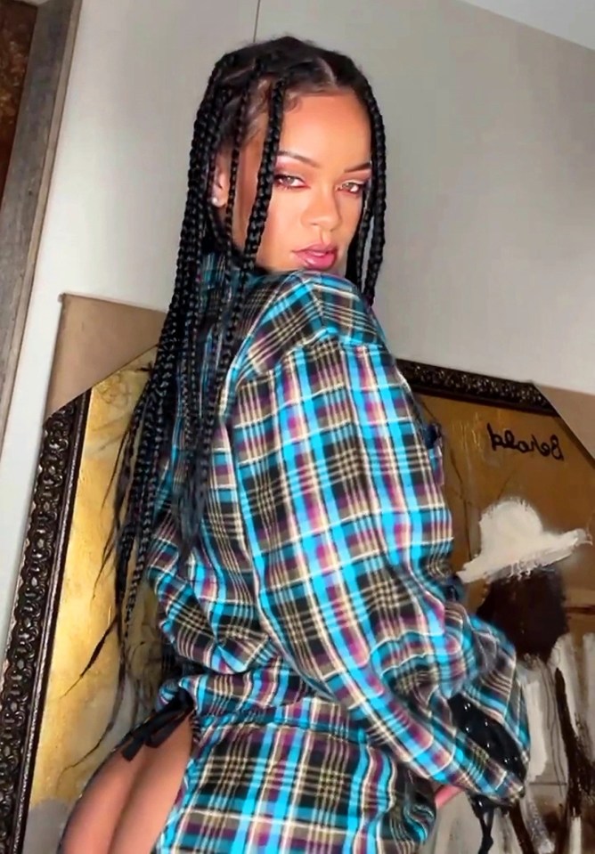 Rihanna posed in this multicoloured tartan set which sported a bizarre cut-out section on her backside