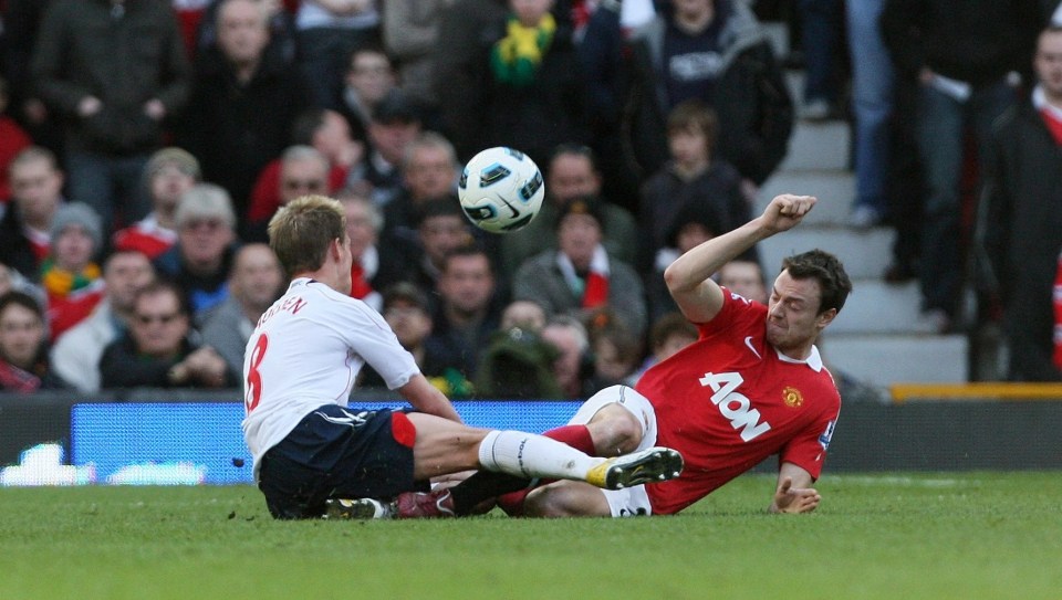 Jonny Evans flies into Stuart Holden at Old Trafford in 2011, a challenge which effectively ended the Bolton midfielder's career