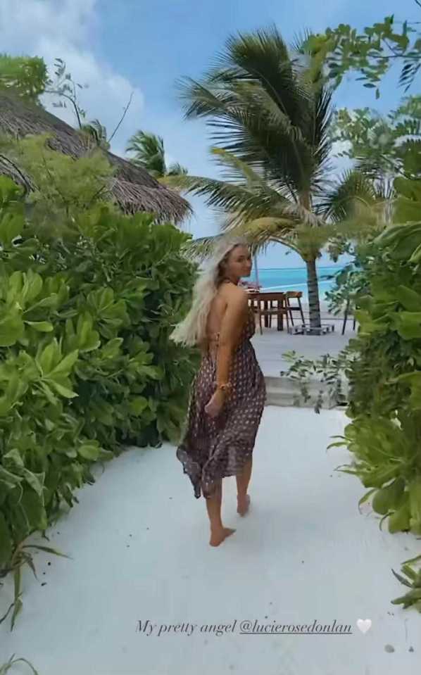 Love Island's Lucie Donlan walks along the sand in the stunning Maldives