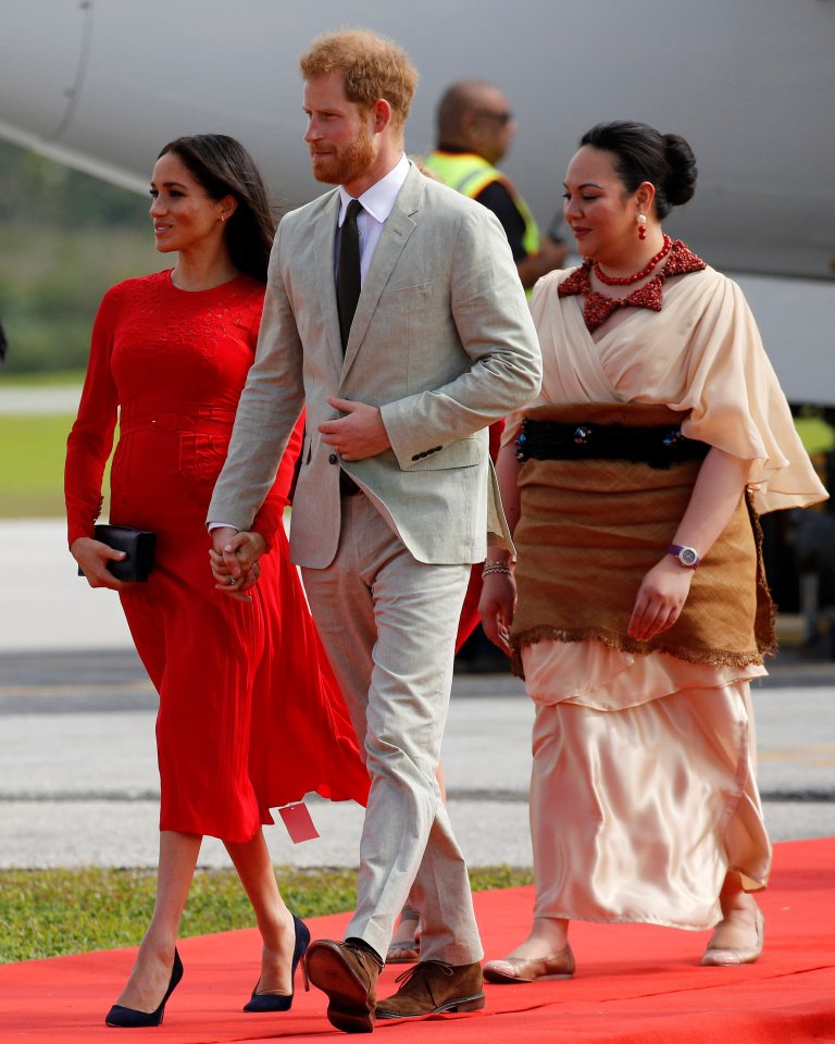 Meghan on royal tour of New Zealand in 2018 with the tag still visible on her dress