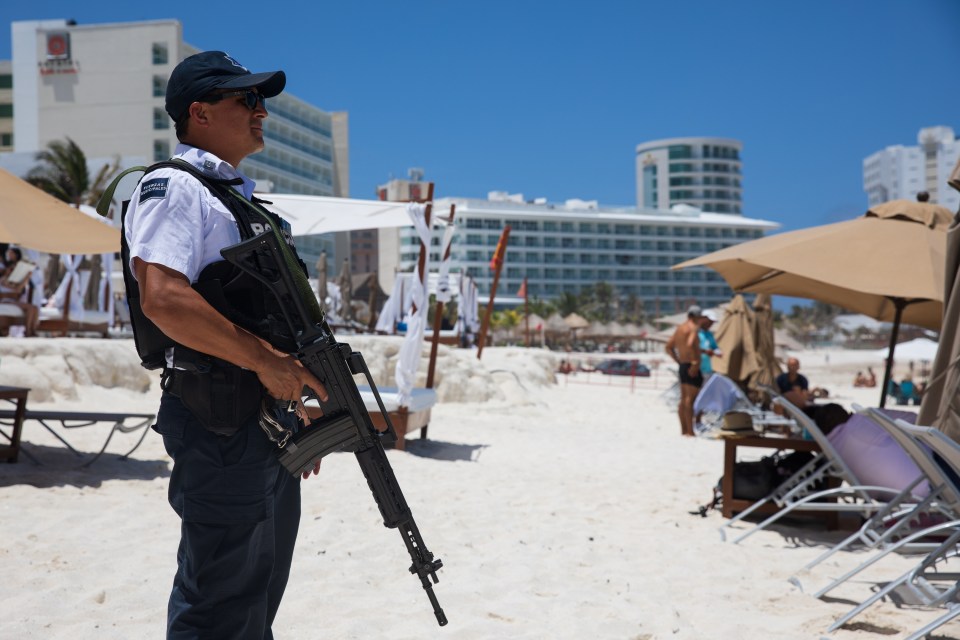 Armed cops on the beach as murderous gangsters wage bloody war at tourist enclaves on the Mayan Riviera