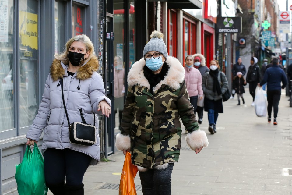 Shoppers wear face masks in north London