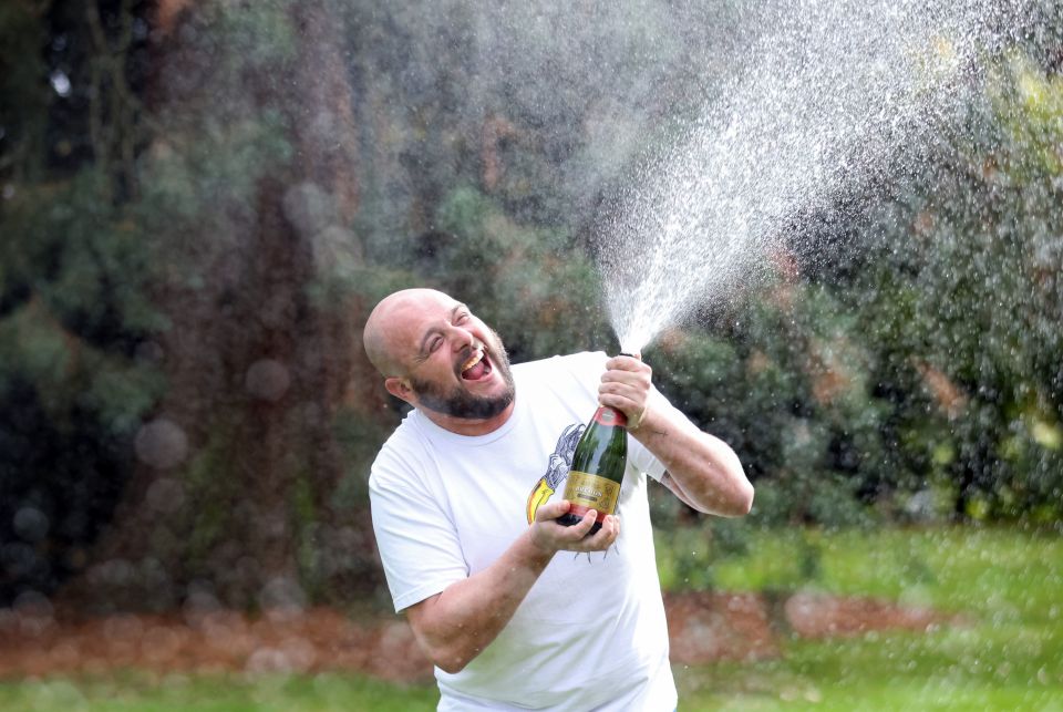 Plumber Sean Irwin celebrating his life-changing scratchcard win