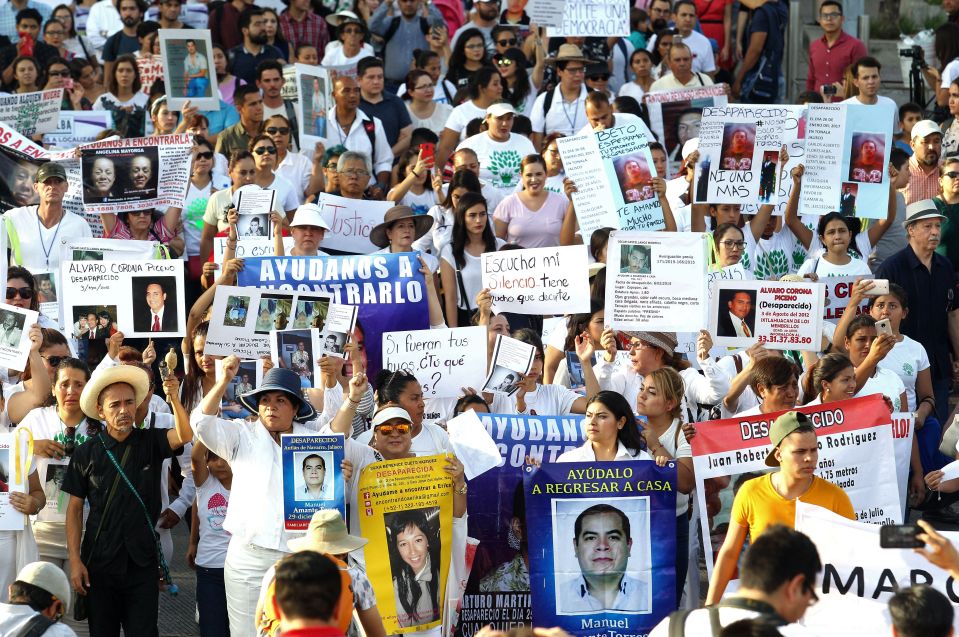 More than 40,000 people have been reported missing in Mexico since 2006 - pictured, their relatives take part in a massive protest against the violence and crime consuming their country