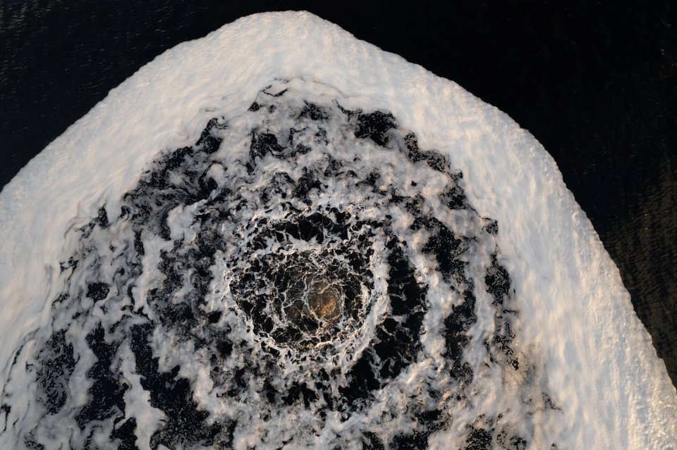 Drone photographs show the whirlpool off the coast of Scotland