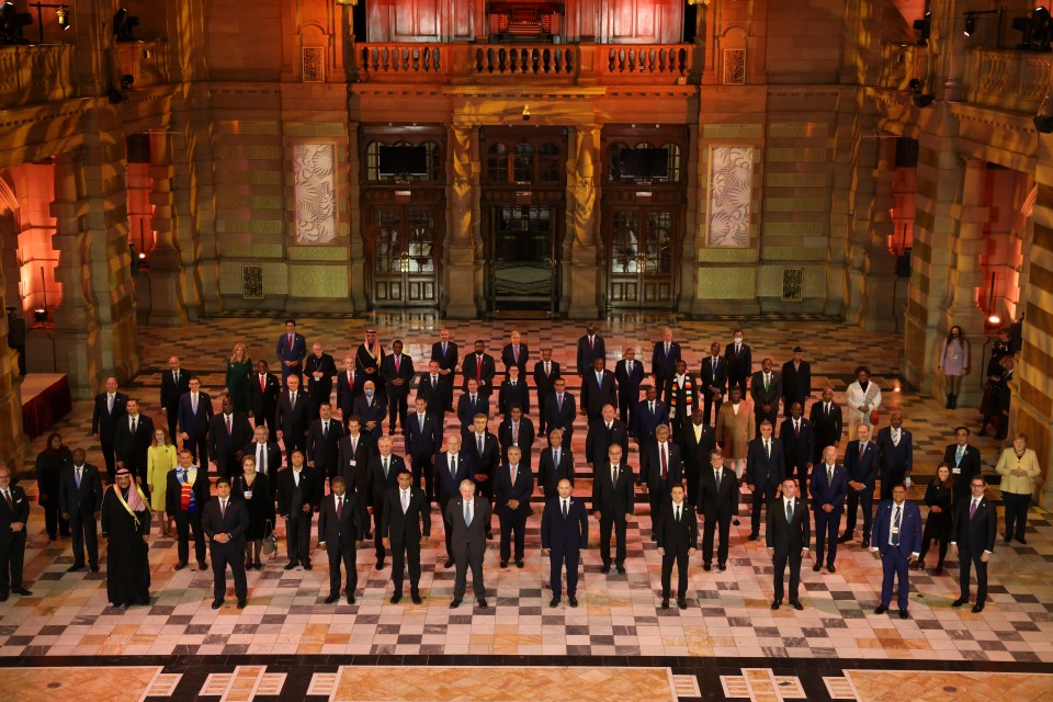 The French President missed the summit's traditional Family Photo