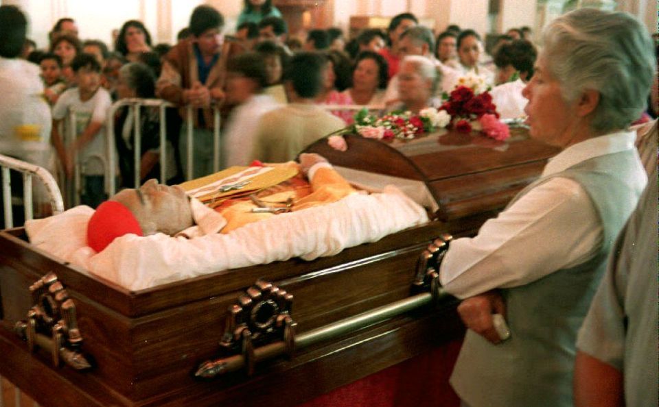 A nun views the remains of Cardinal Juan Jesus Posadas Ocampo after he was caught up and killed in a narco drug fight in 1993