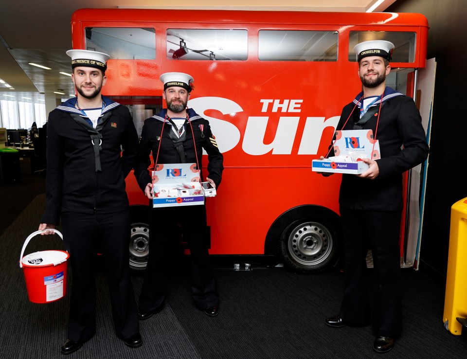 Members of the Royal Navy sell poppies at The Sun’s office in London