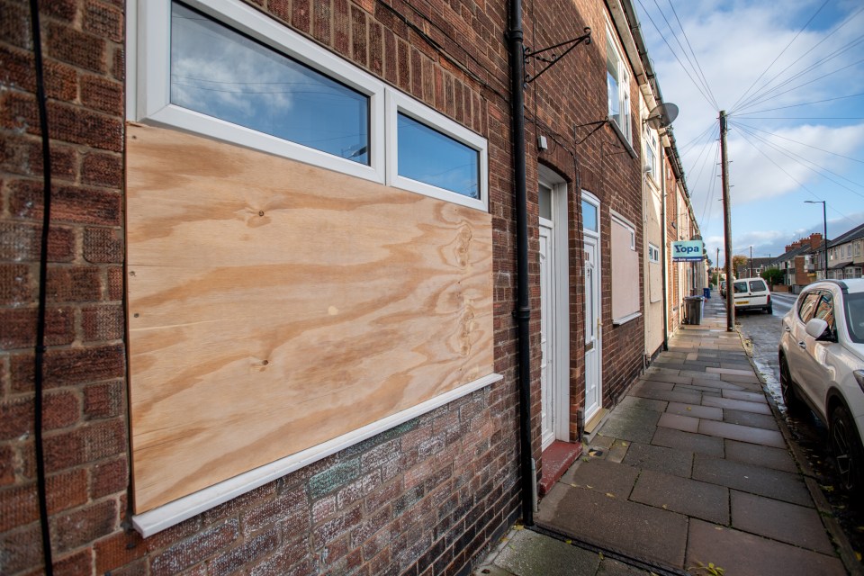 More boarded up windows on the residential road