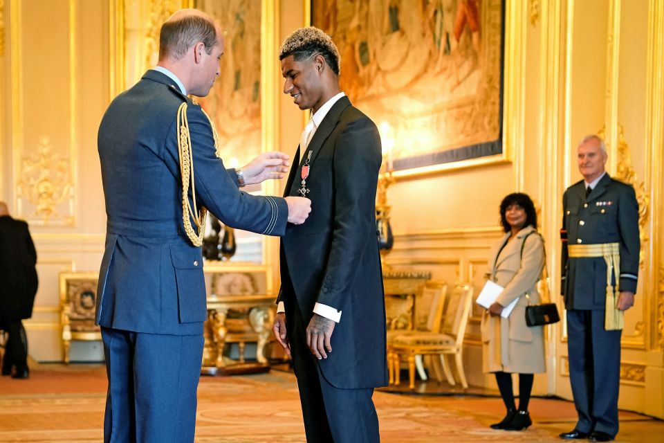 The footie ace received his award from Prince William today as his proud mum watched on