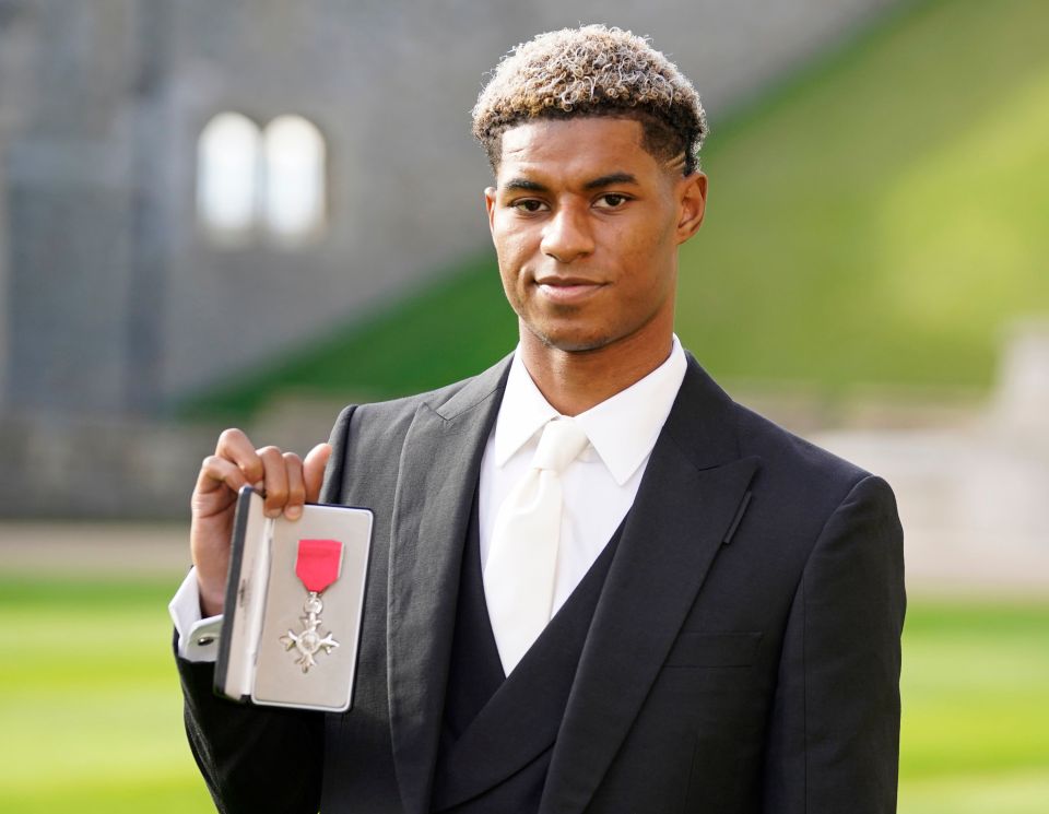 The footballer holds his MBE with pride