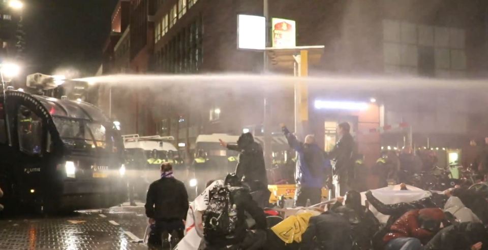 Anti-lockdown protesters blasted with water cannons during a demonstration